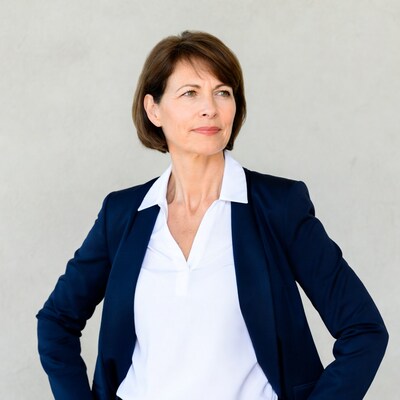 Mature woman in navy blazer looking up