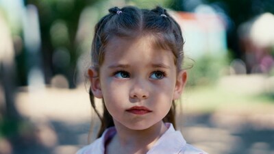 Girl with pigtails in park