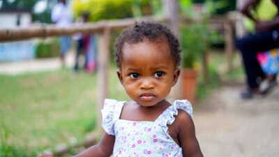 African baby girl pouting outdoors