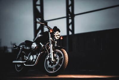 Black Suzuki Motorcycle Near Industrial Bridge