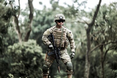 Asian soldier with rifle in jungle