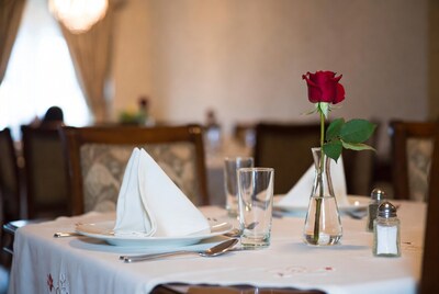 Red Rose in Vase on Restaurant Table