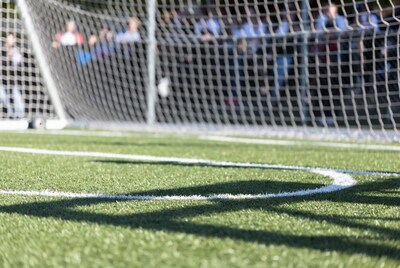 Soccer goal with blurred crowd
