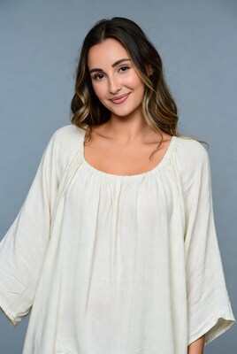 Smiling woman in white blouse