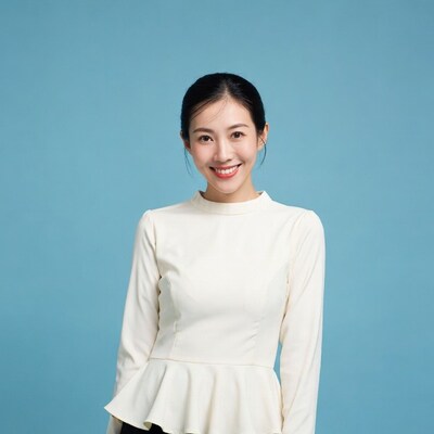 Asian woman smiling in white blouse