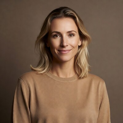 Smiling woman in beige sweater
