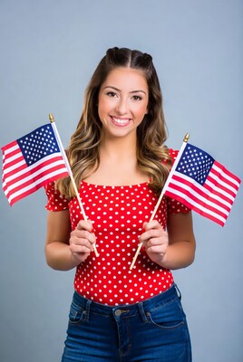 Smiling woman holding American flags