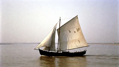 Traditional sailboat on river