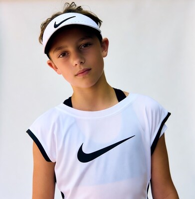 Boy in Nike tennis visor and tank top