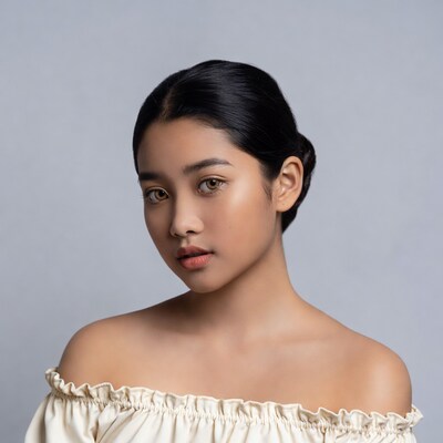 Asian woman in off-shoulder top