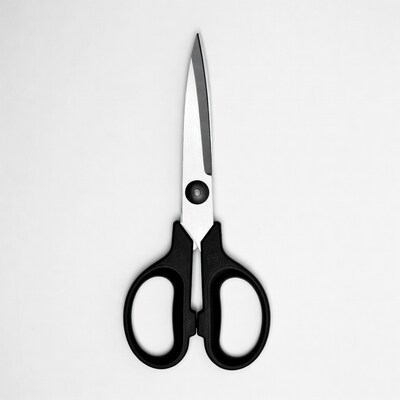 Black handled scissors on white background