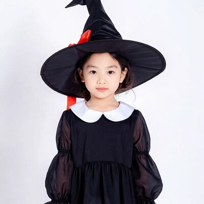 Asian girl in black witch costume