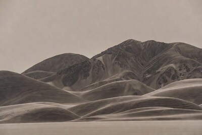 Sand Dunes in Misty Landscape