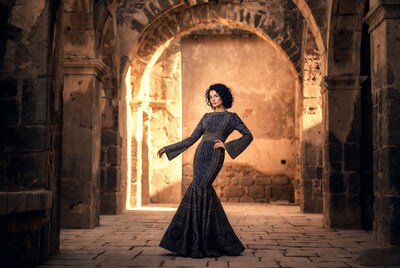 Woman in embroidered gown in ancient ruins