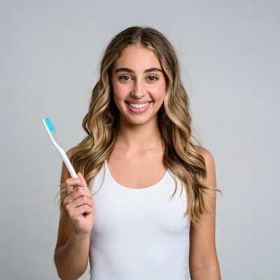 Smiling woman holding toothbrush
