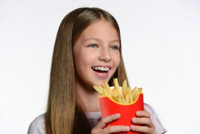 Girl holding french fries box
