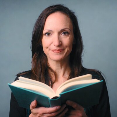 Woman holding open book