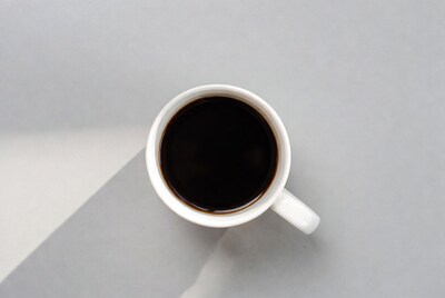 Top view black coffee in white mug