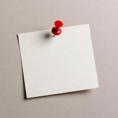 Red pushpin on blank note