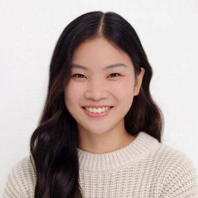 Smiling Asian woman in white sweater