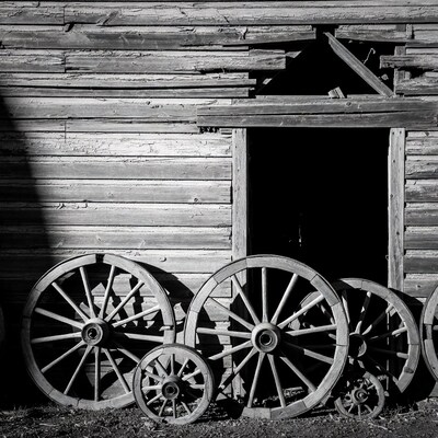 Old wagon wheels by barn door