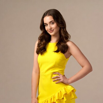 Young woman in yellow ruffle dress