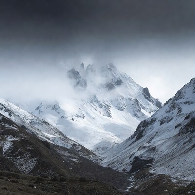 Snowy Mountains in Foggy Valley