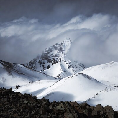 Snowy Mountain Peak in Clouds