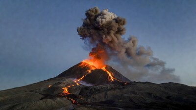 Erupting volcano with lava and ash plume