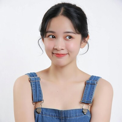 Asian girl in denim overalls smiling