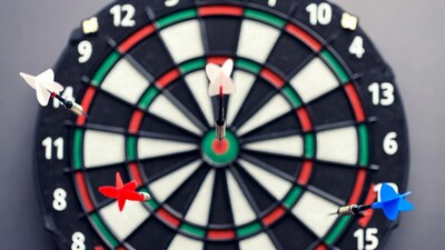 Dartboard with colorful darts