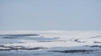 Snowy Hills Landscape Under Blue Sky