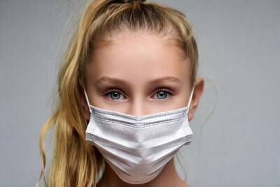 Girl with ponytail wearing face mask
