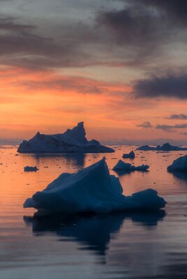 Icebergs in sunset Arctic sea