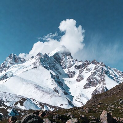 Snowy Mountain Peak with Clouds