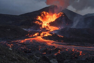 Erupting volcano with glowing lava flows