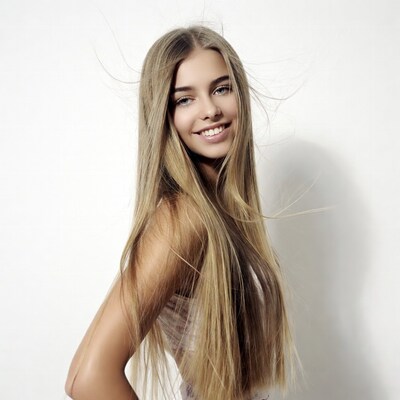 Smiling woman with flowing blonde hair