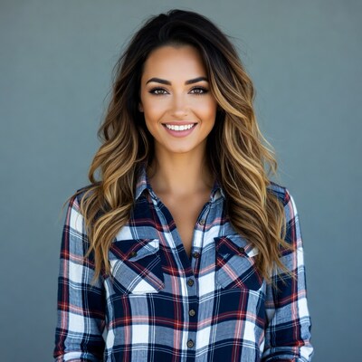 Smiling woman in plaid shirt