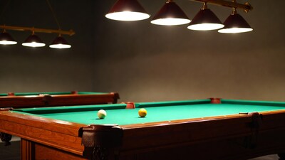 Pool table with balls under lights