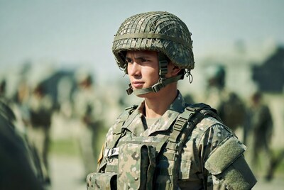 Soldier in camouflage helmet profile view