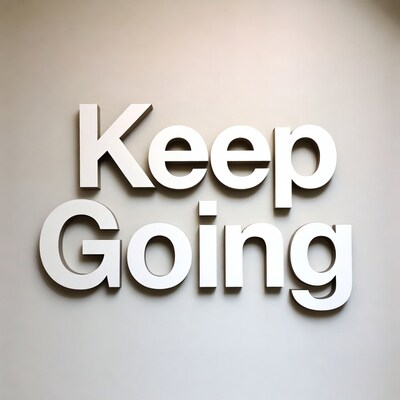 Keep Going wooden letters on wall