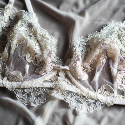 White Lace Bra on Gray Fabric