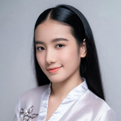 Asian woman in white blouse smiling