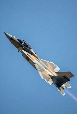F-15 fighter jet climbing with afterburner