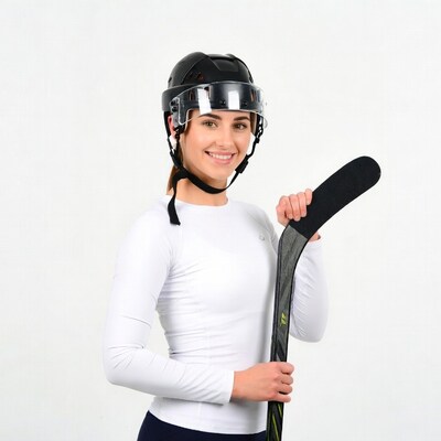 Woman in hockey helmet holding stick