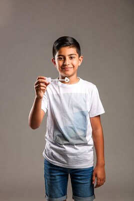 Boy blowing bubble wand