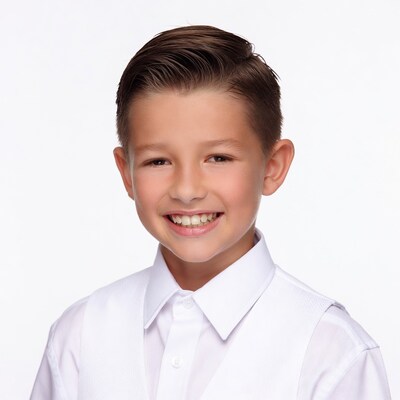 Smiling boy in white shirt