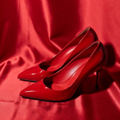 Red patent high heels on red satin