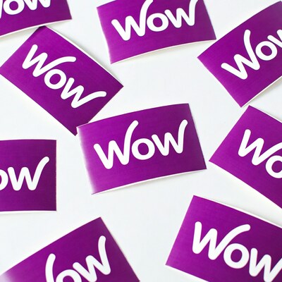 Purple WOW Stickers on White Background