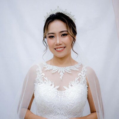 Asian bride in lace wedding dress